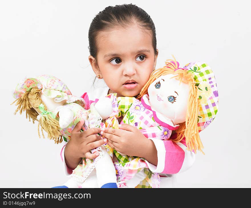 Asian girl of indian origin with dolls. Asian girl of indian origin with dolls