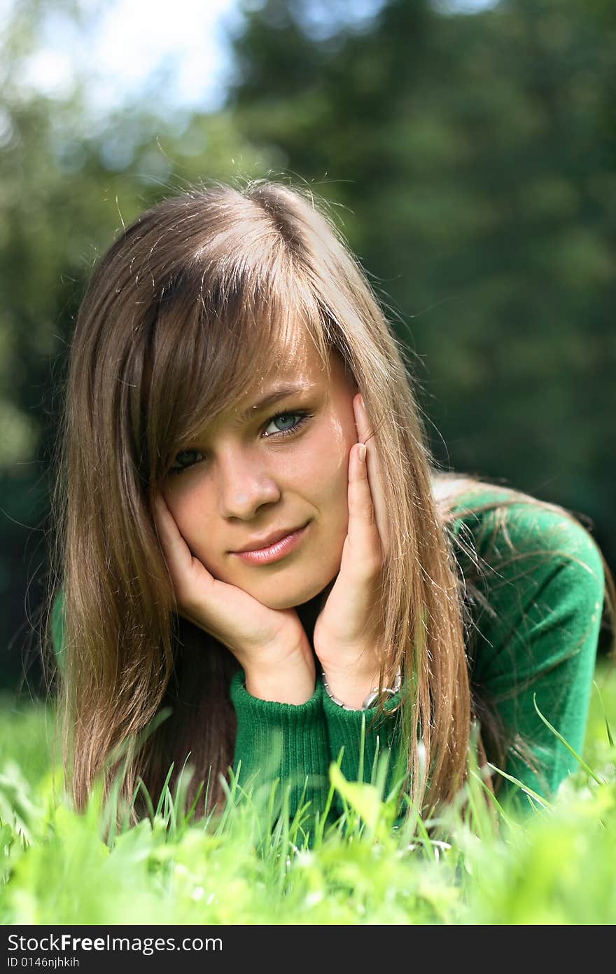 A portrait of a gorgeous girl on the grass