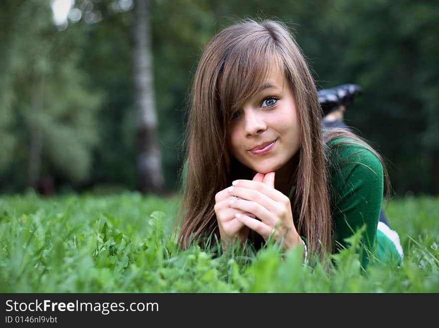 A Portrait Of A Gorgeous Girl On The Grass