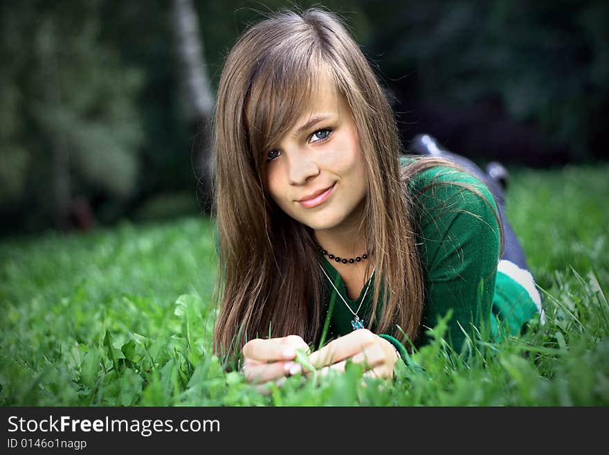 A Portrait Of A Gorgeous Girl On The Grass