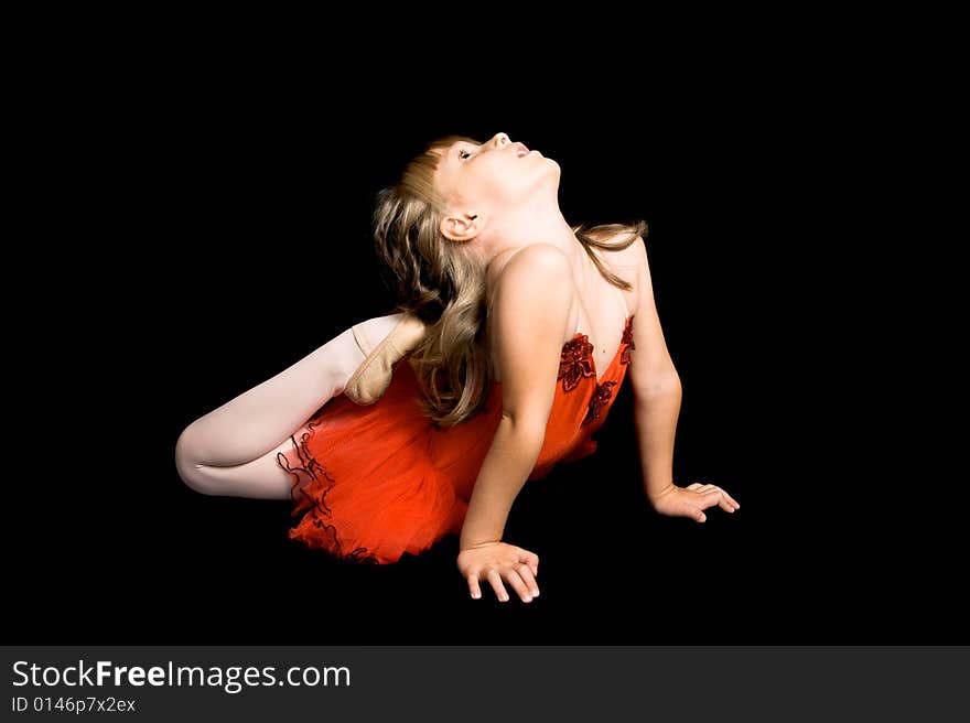 Young ballet dancer wearing a red costume. Young ballet dancer wearing a red costume