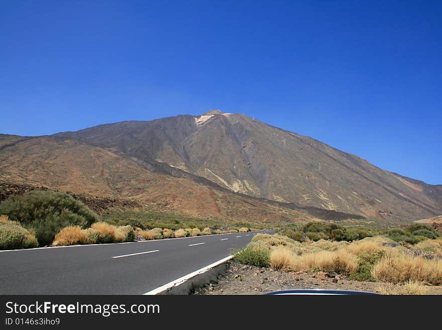 Lonely road at a high plateau leading to the Teide volcano in the Canary Island of Tenerife. Lonely road at a high plateau leading to the Teide volcano in the Canary Island of Tenerife