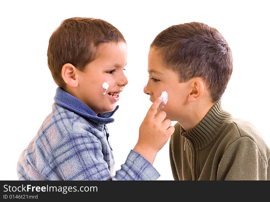 Children with pomade on the visage. Children with pomade on the visage