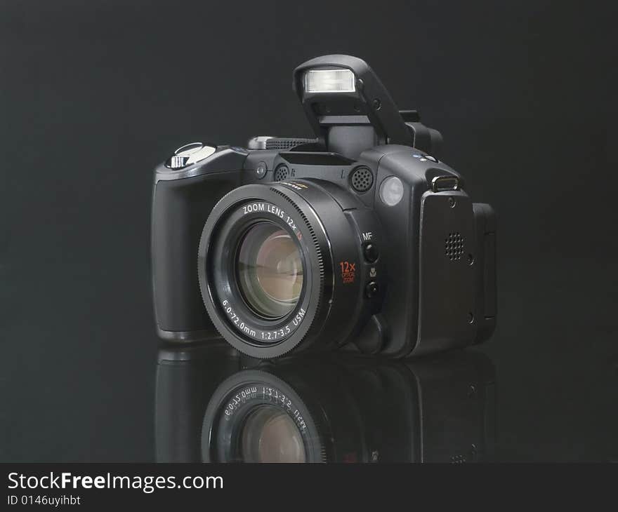 Digital camera isolated on black background