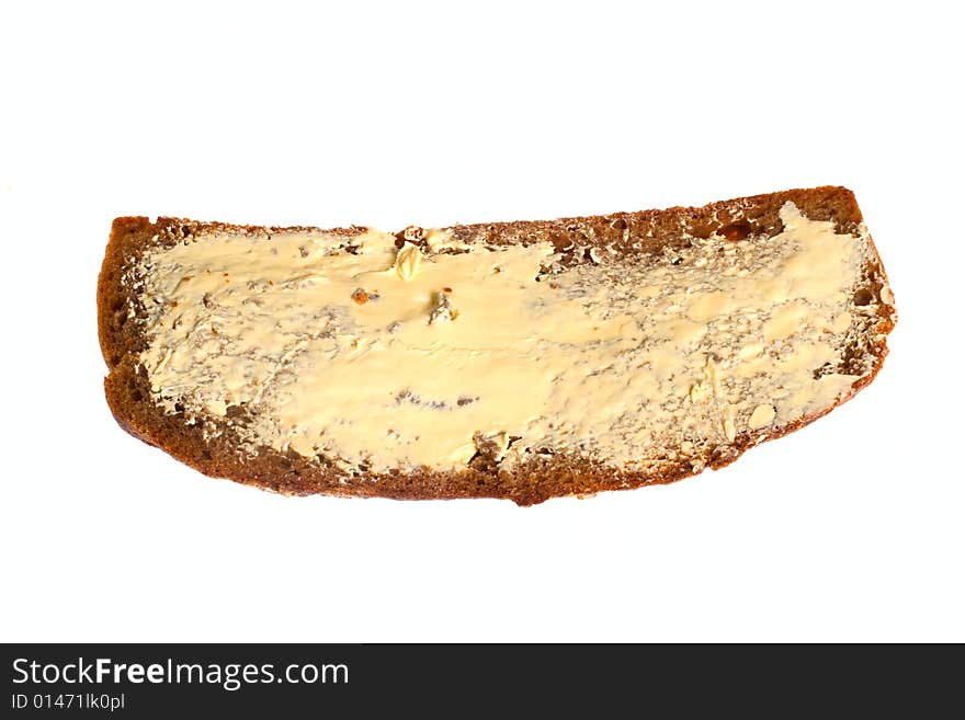 Dark bread with butter, photo on the white background