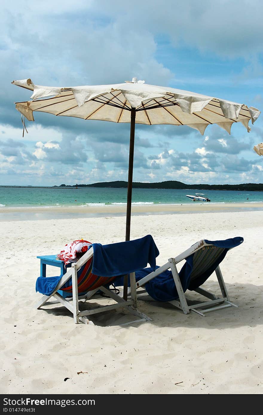 Two chairs on beautiful beach.