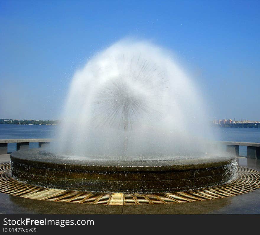 Fresh fountain in sunny summer day