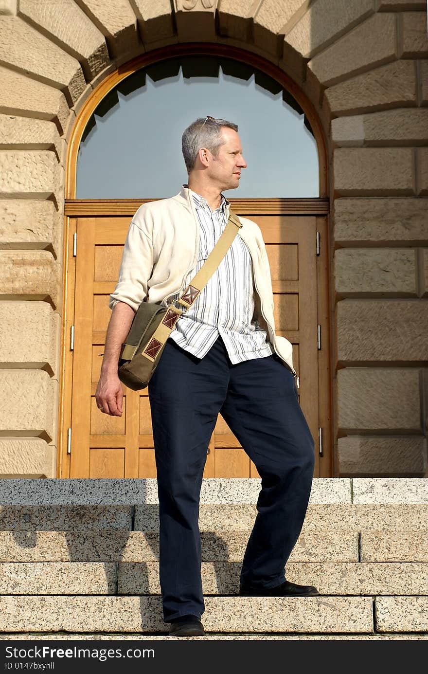 35-50 years male looking at sky on stairs. 35-50 years male looking at sky on stairs