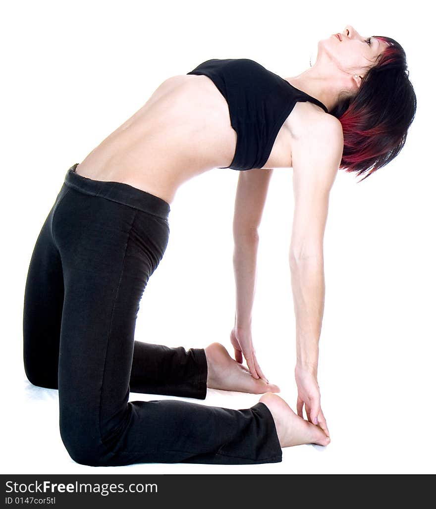 Young woman doing floor exercise, studio shut