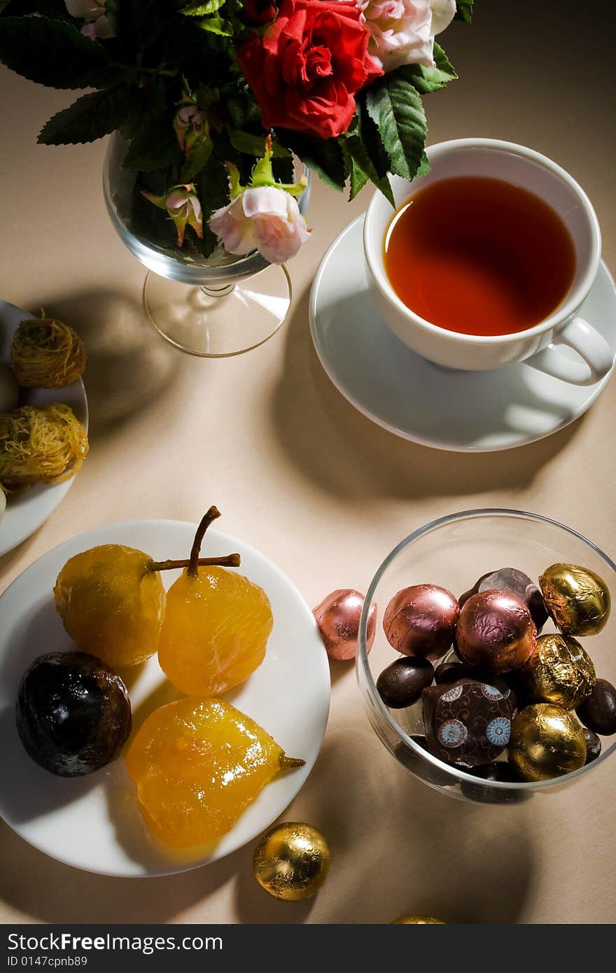 Cup of tea and sweet on a table