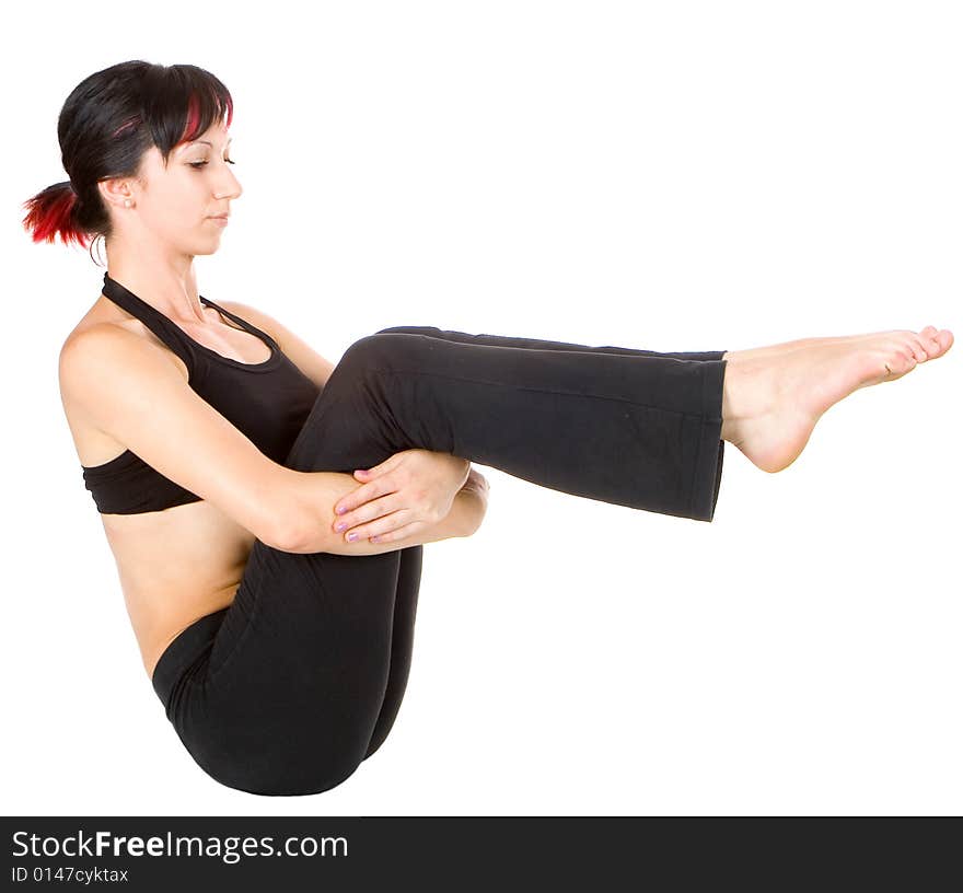 Young woman doing floor exercise, studio shut