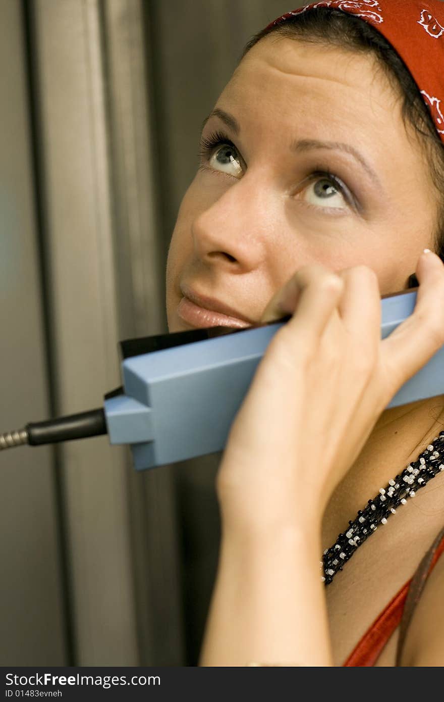 Girl having a call on a telephone