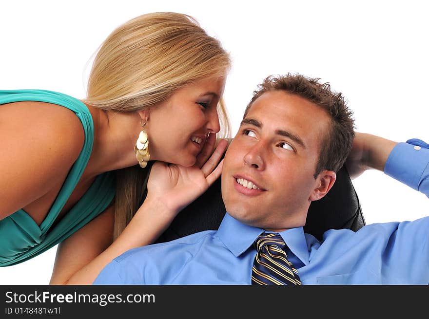 Businessman and young woman whispering secrets against a white background. Businessman and young woman whispering secrets against a white background