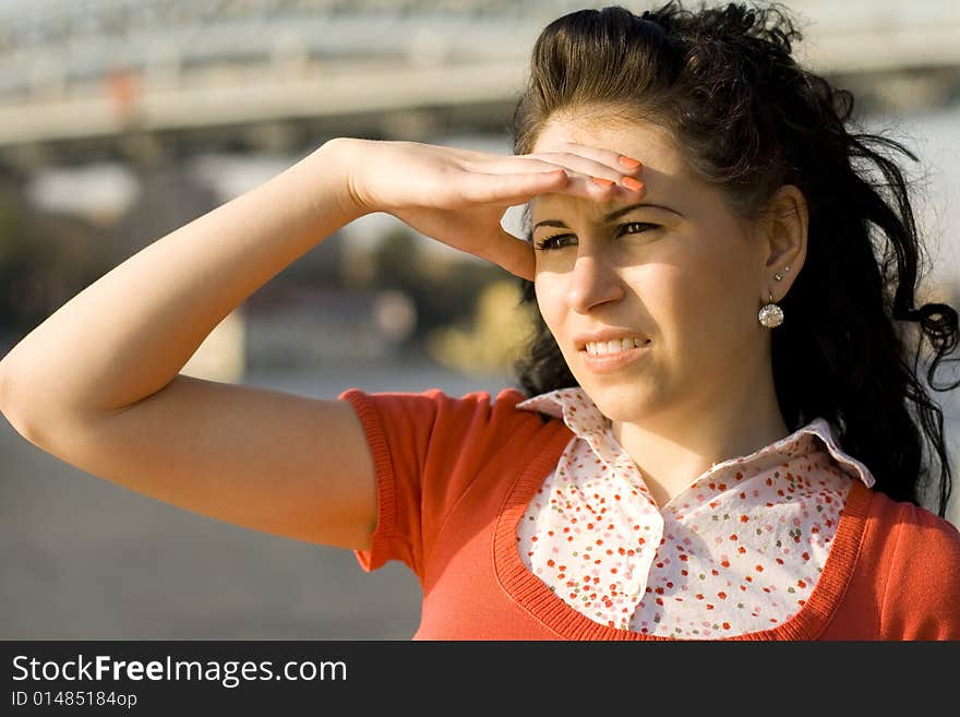 Woman looking at river water