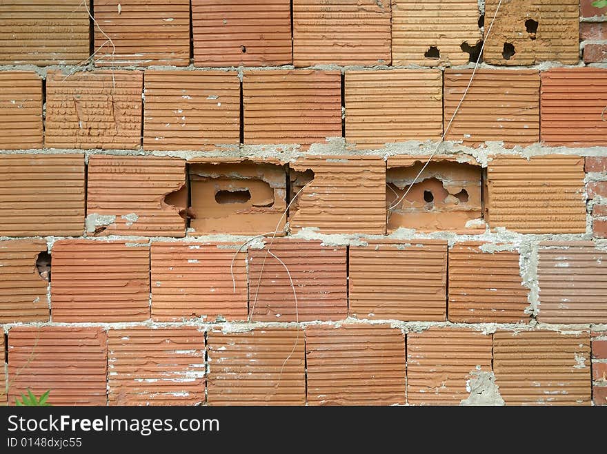 Large red brick building blocks in old wall. Large red brick building blocks in old wall