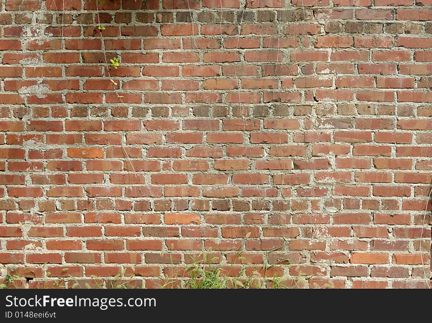 Close up of old weathered red brick wall