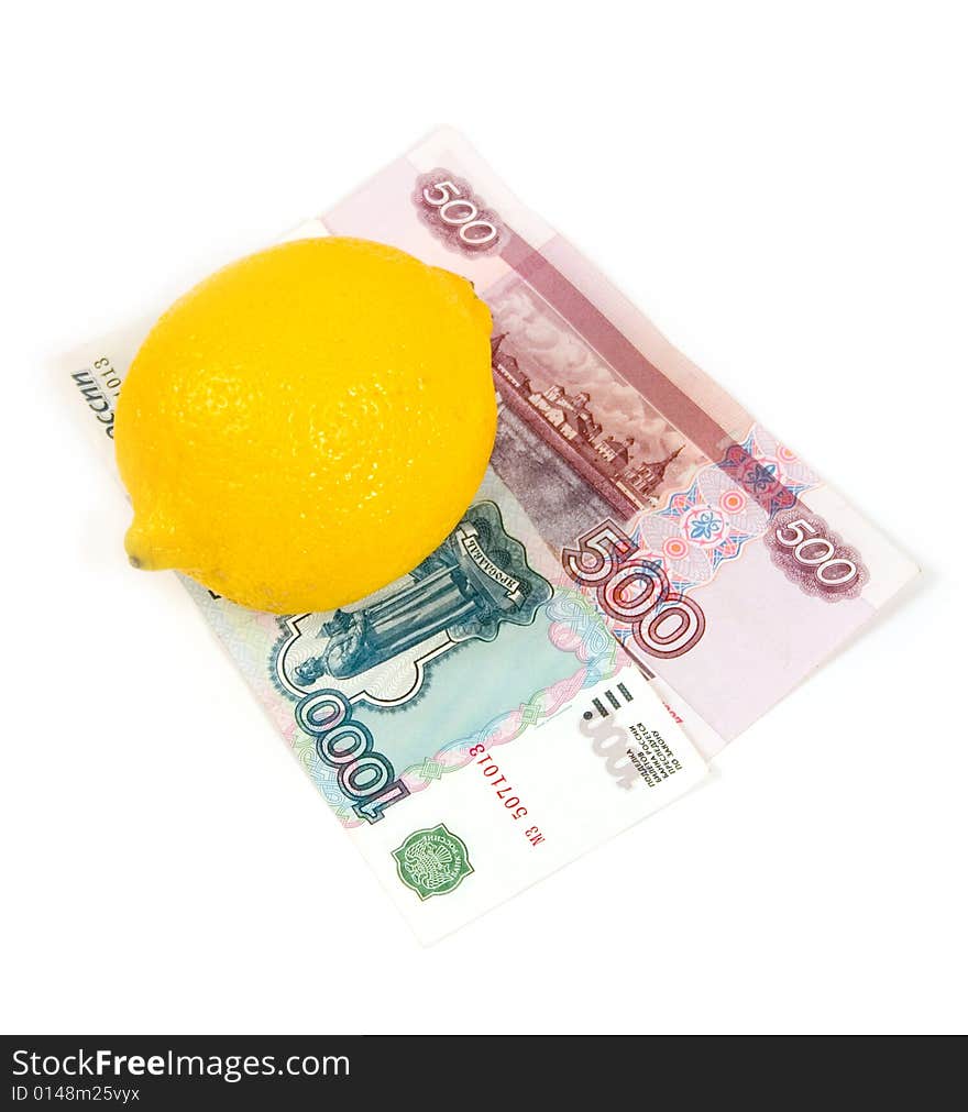 Tickets of bank of Russia with a yellow lemon on a white background. Tickets of bank of Russia with a yellow lemon on a white background