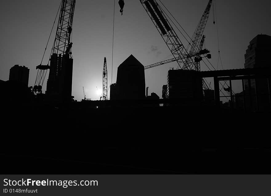 Pictures of construction machinery in siloutte. Good for explaining contexts of construction, property boom, land development, etc. Pictures of construction machinery in siloutte. Good for explaining contexts of construction, property boom, land development, etc