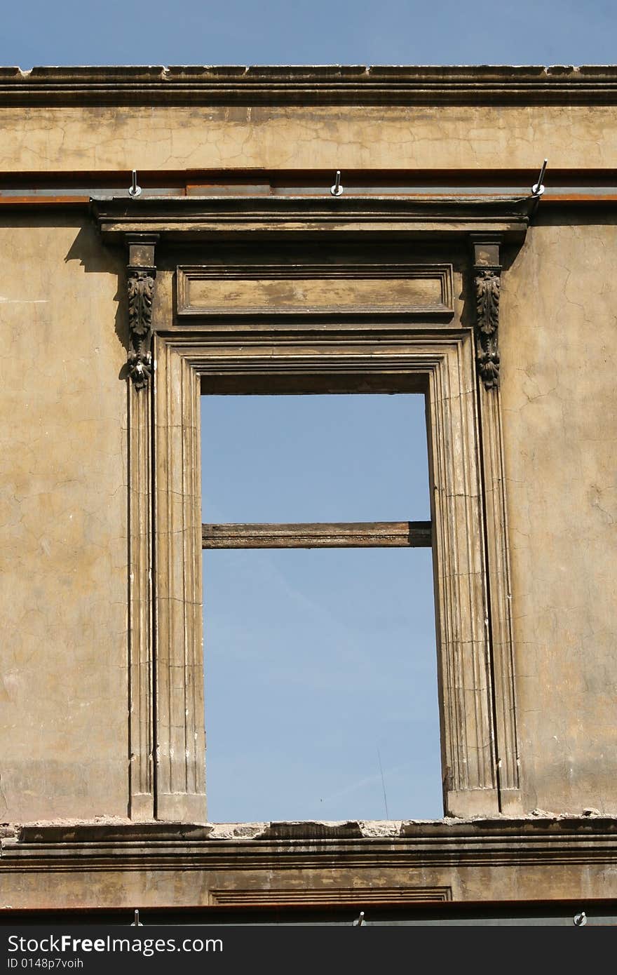 Center of cracow / krakow in poland, famous building, this detail shows polish architecture from that times, building under construction, front wall left only. Center of cracow / krakow in poland, famous building, this detail shows polish architecture from that times, building under construction, front wall left only