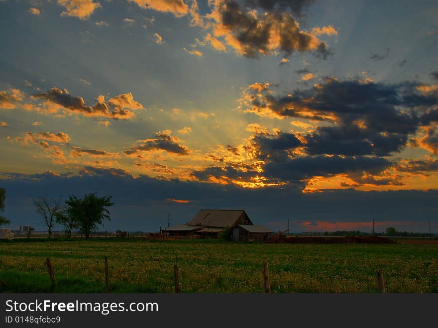 Beaming Sunset Over Rustic Barn