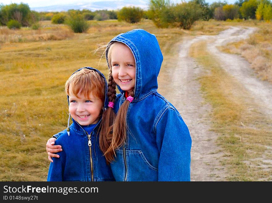 Girl and boy standing or running on the road