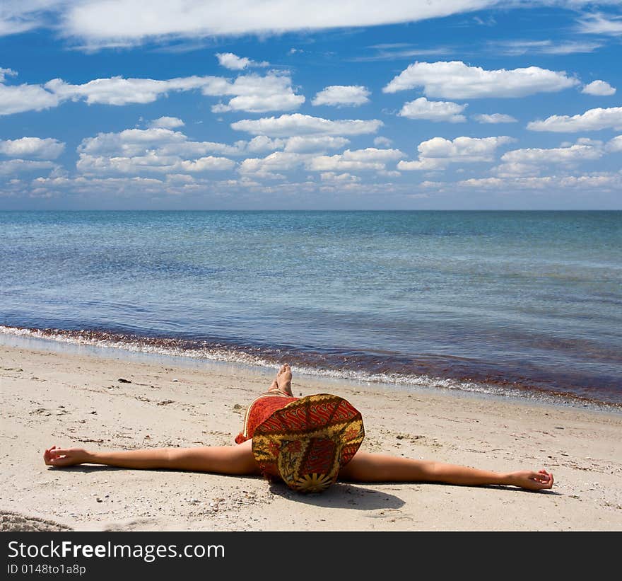 Girl in hat at seaside