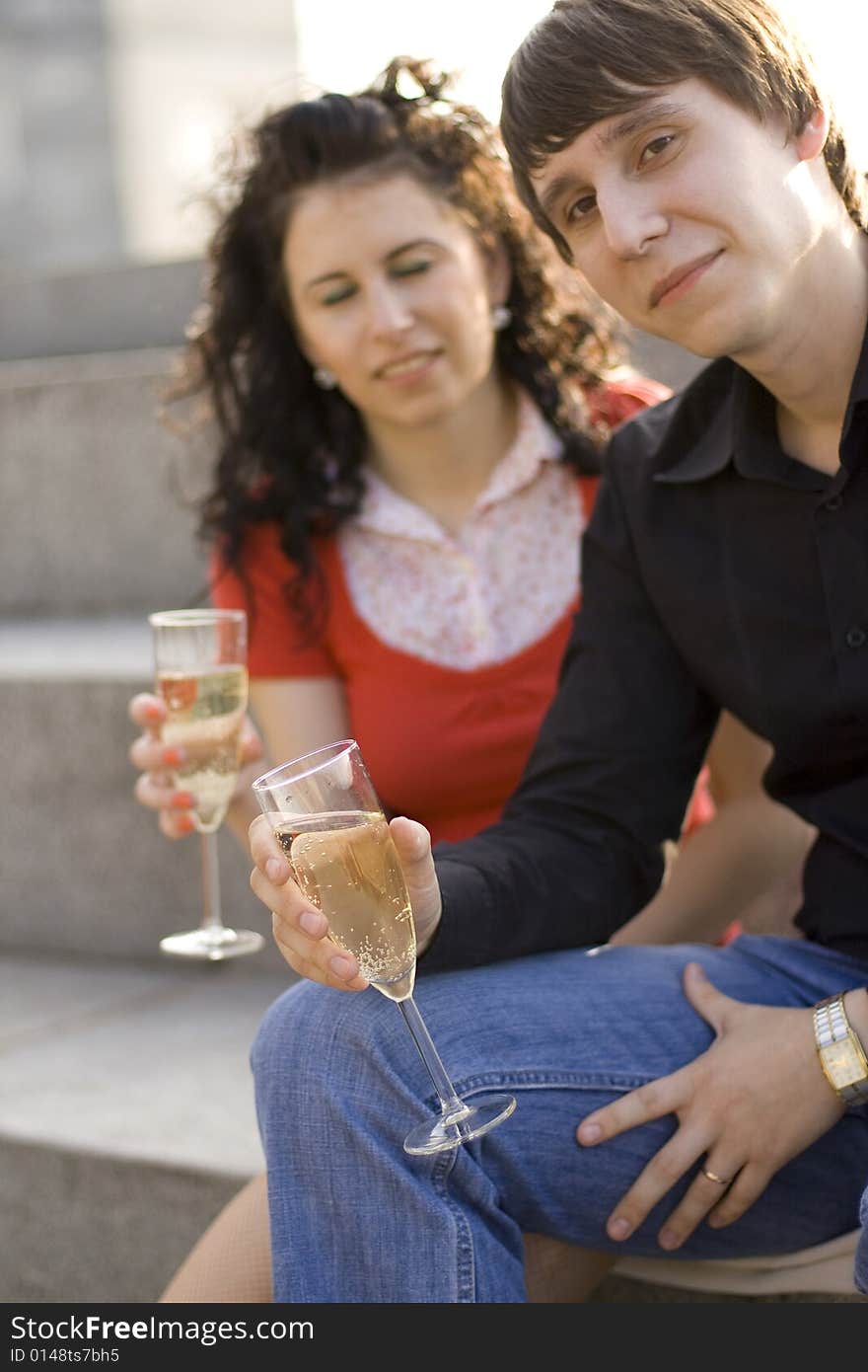 Happy couple celebrating with champagne