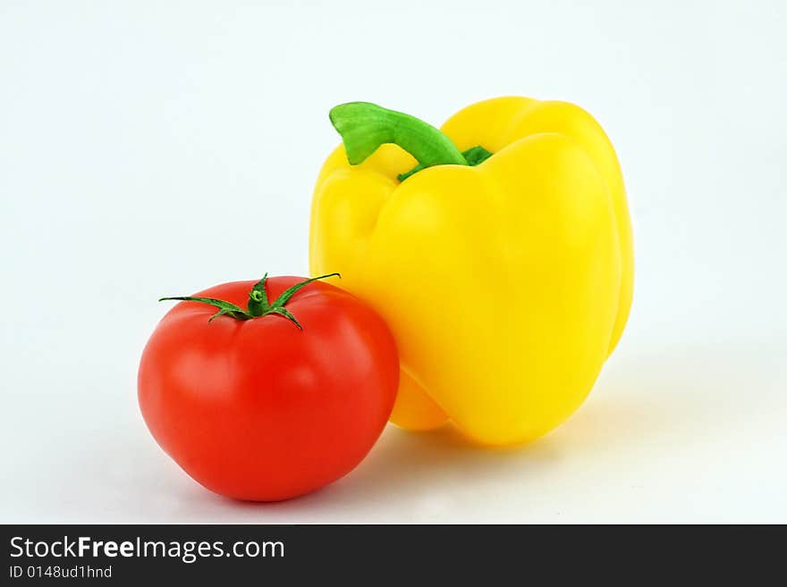 Yellow pepper and red tomato