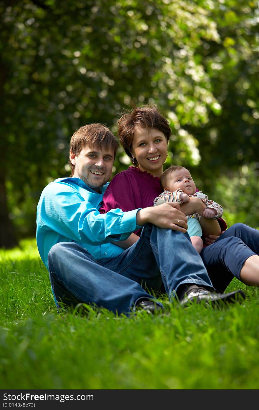 Young family with child in the park. Young family with child in the park