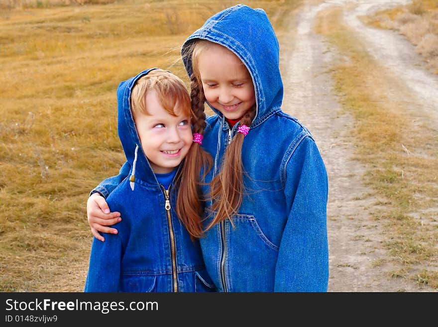 Girl and boy standing or running on the road