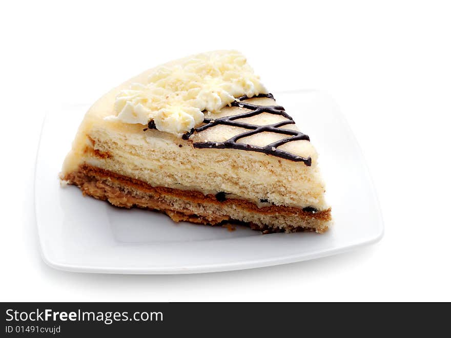 Cheesecake on a Plate. Isolated on White Background. Cheesecake on a Plate. Isolated on White Background