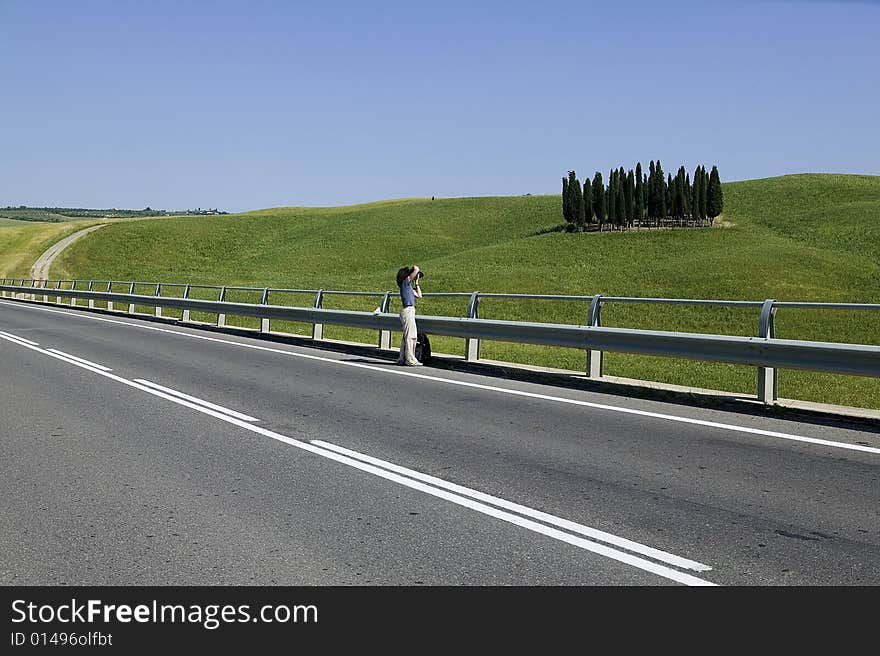 TUSCANY countryside with cypress and road