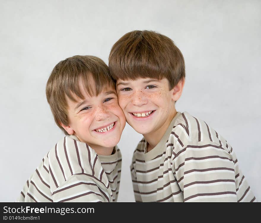 Brothers Against a White Background