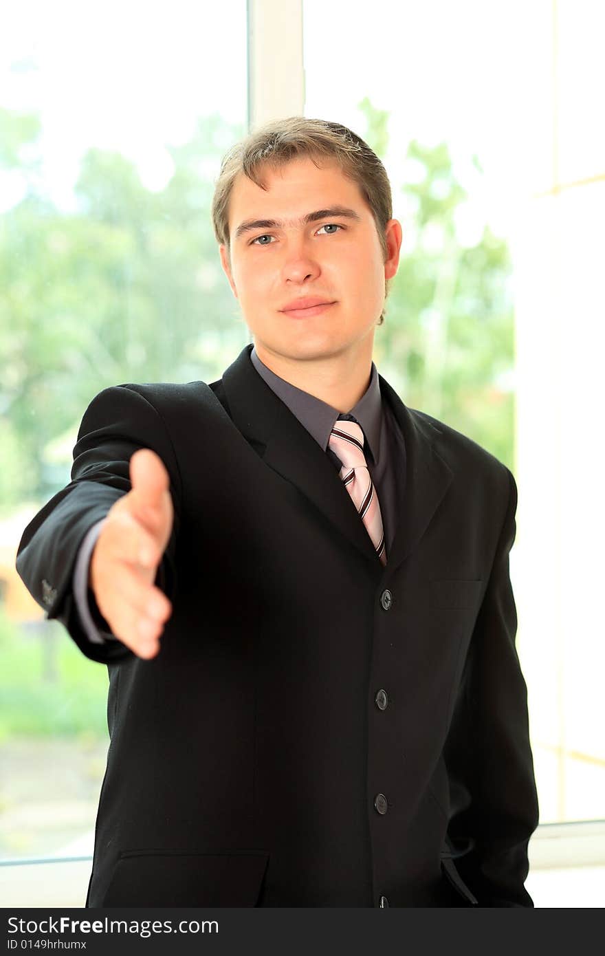 Business background: handsome businessman in a work process. Business background: handsome businessman in a work process.