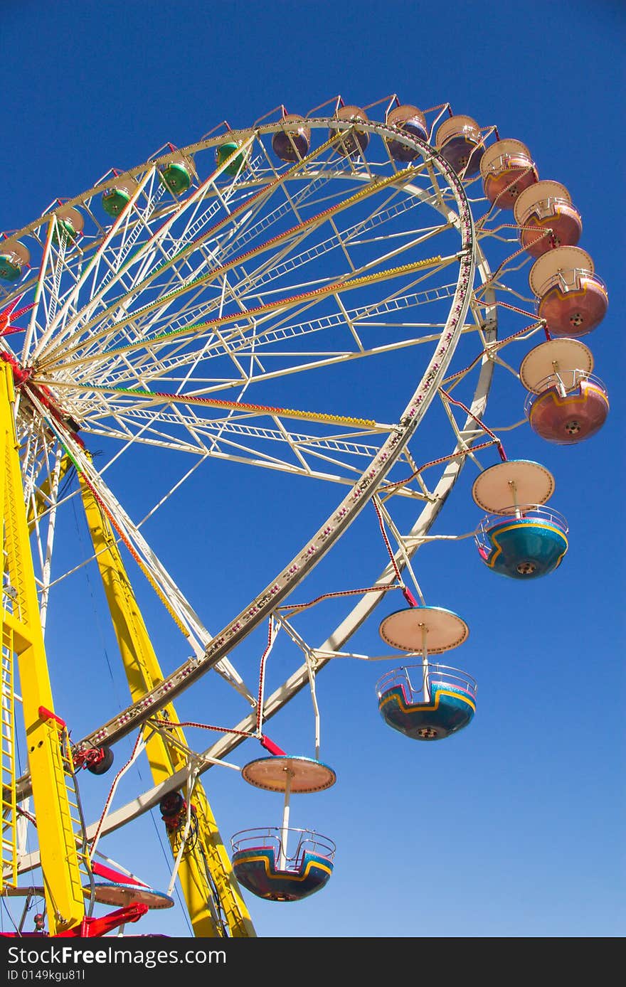 Observation wheel  under blue skies