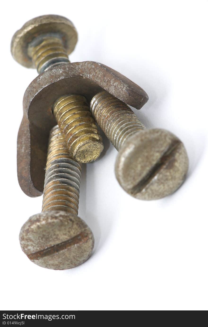 Bolts and nuts forming a human shape on white background. Bolts and nuts forming a human shape on white background