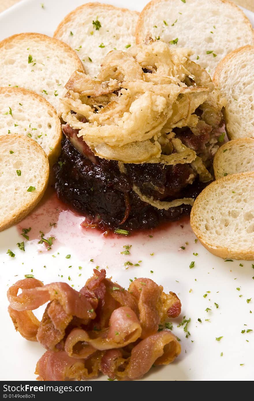 A plate of delicious pate with cranberry sauce and bread slices. A plate of delicious pate with cranberry sauce and bread slices