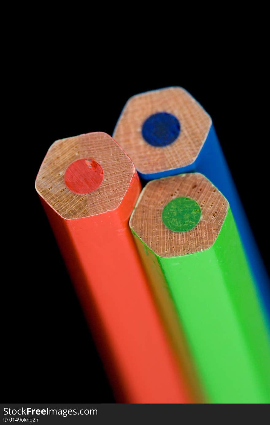 Colored pencils closeup on dark background. Colored pencils closeup on dark background