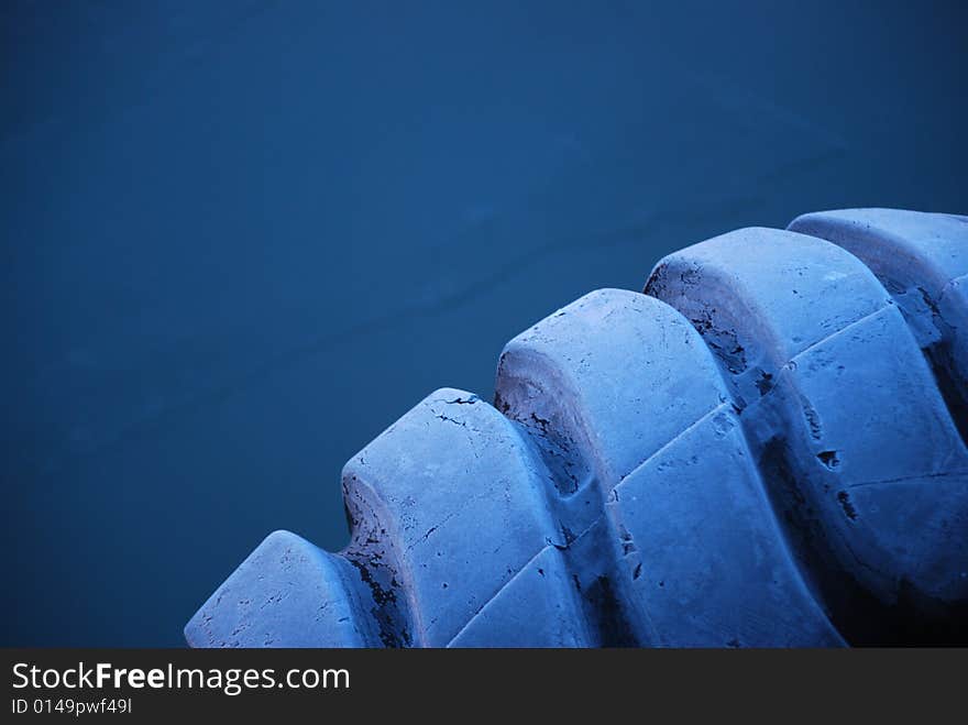 Blue tire in the docks