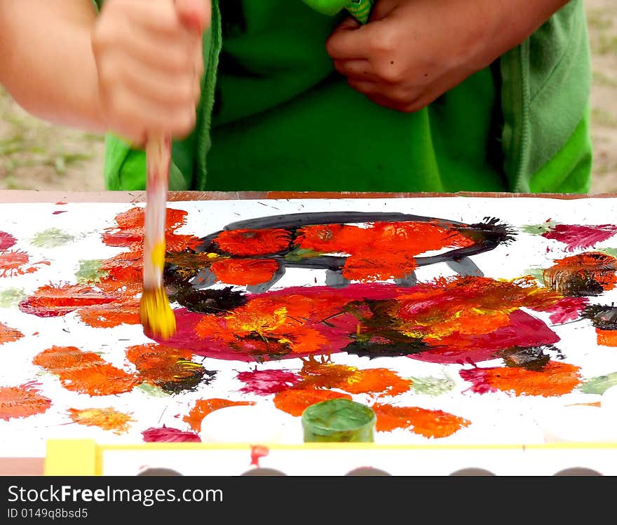 Kid painting the picture, colorful abstract