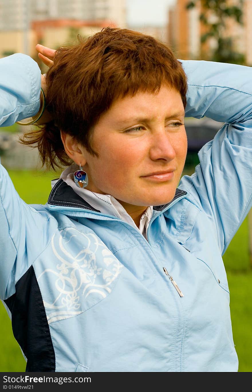 Outdoor portrait of pretty woman in blue