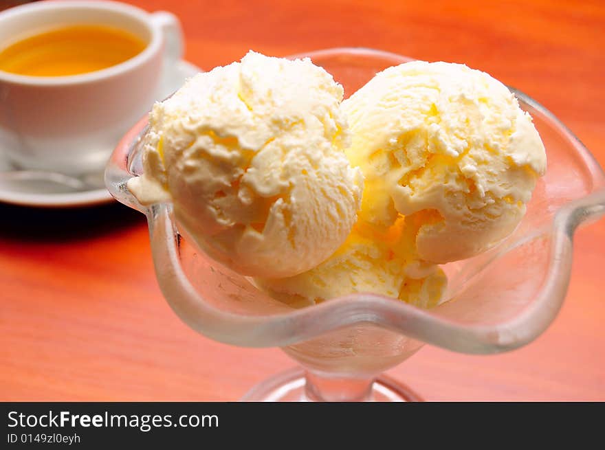 Close-up of cup of tea and ice cream, shallow DOF. Close-up of cup of tea and ice cream, shallow DOF