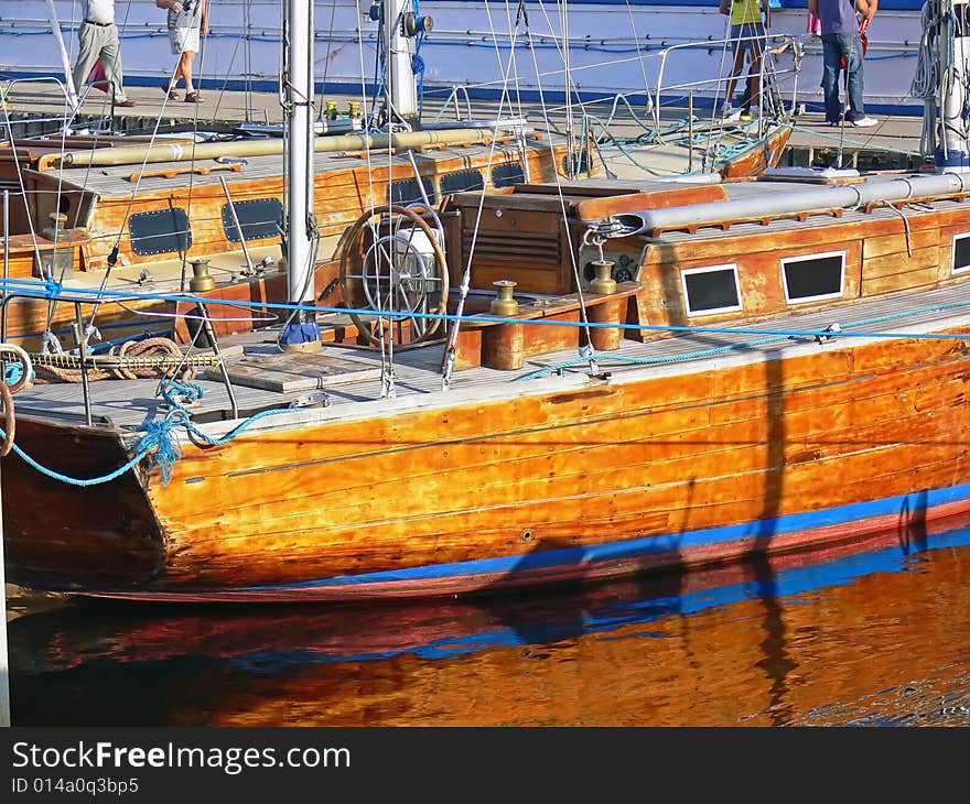 The wooden sailing boat in harbour - close up. The wooden sailing boat in harbour - close up.