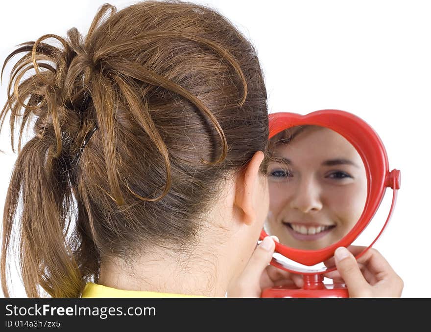 Girl and mirror isolated on white background