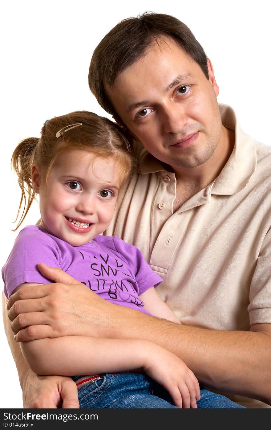 Lovely little daughter is sitting on the laps of her father. Lovely little daughter is sitting on the laps of her father