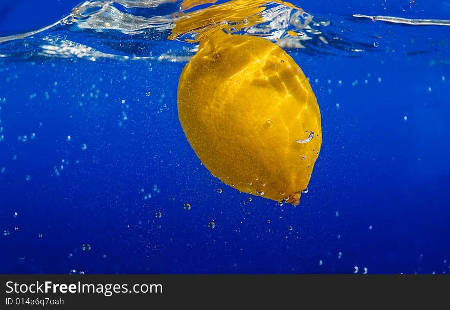 A fresh lemon in the water