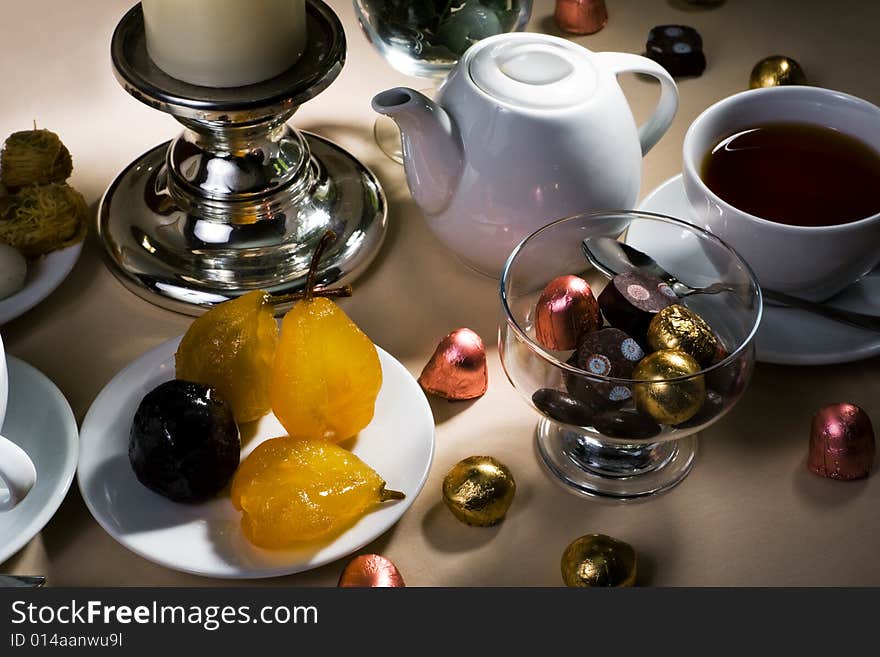 Cup of tea and sweet on a table