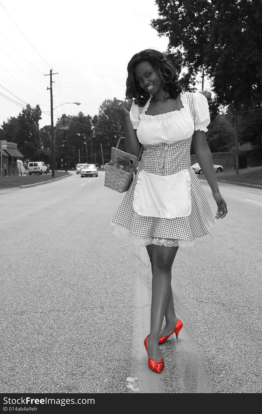 Modern Day Dorothy, desaturated with red ruby shoes. Modern Day Dorothy, desaturated with red ruby shoes