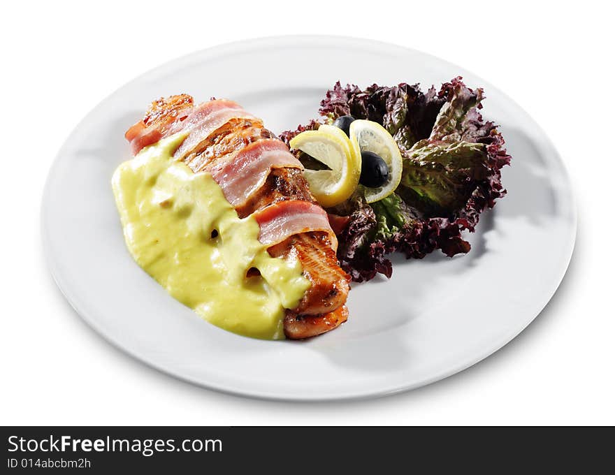 Salmon Steak in Bacon with Lemon Sauce. Isolated on White Background