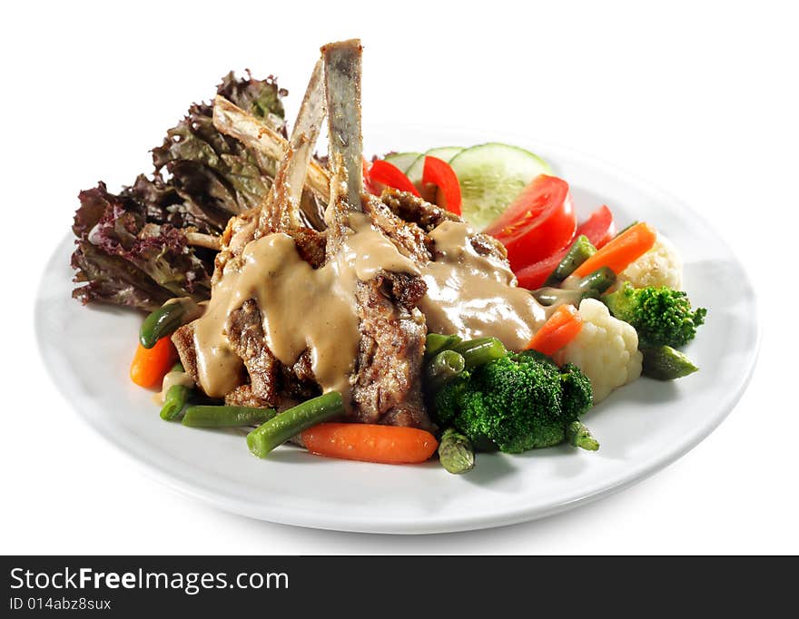 Pork Ribs Plate with Vegetables and Cabbage. Isolated on White Background